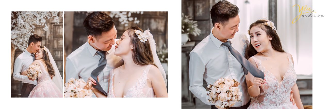 chú rể hôn nhẹ lên trán cô dâu