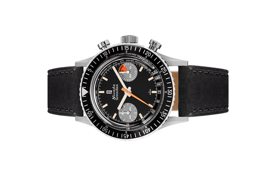 Đồng hồ đeo tay thương hiệu Nivada Grenchen, dòng sản phẩm Chronomaster Orange Boy SL, Ref no: 86015M, mặt số đen, size 38mm, lên dây cót bằng tay, vỏ đồng hồ bằng thép không gỉ và dây da bò, mới 100%