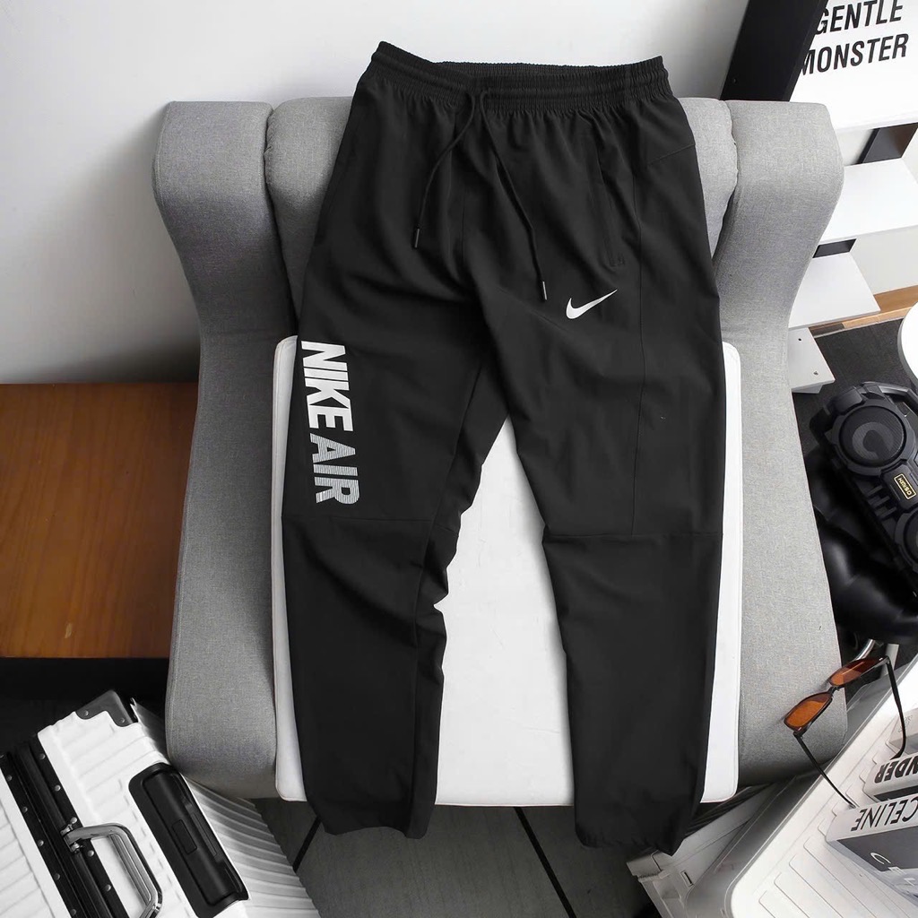Quần dài Nike vải dù ống suông