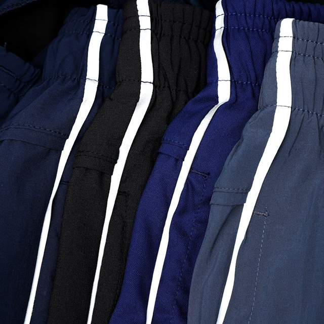 Quần thể thao CAROLLA vải dù có sọc phản quang