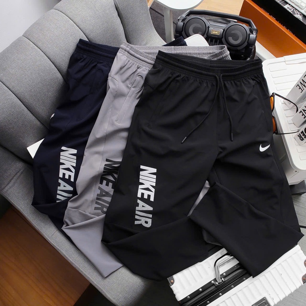 Quần dài Nike vải dù ống suông