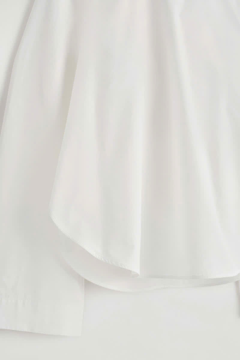 Áo cánh cotton viền cong
