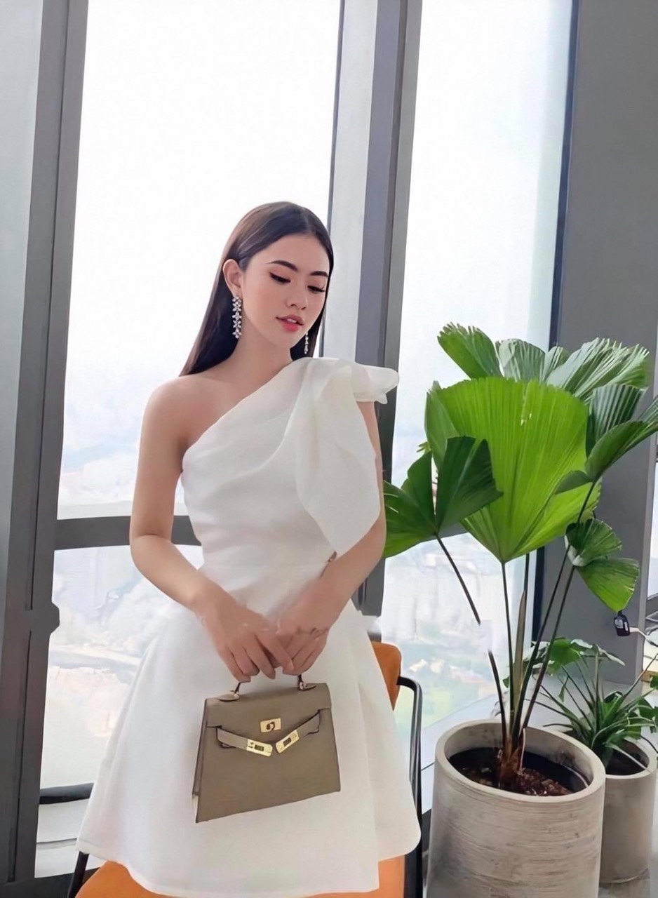 Đầm xoè kiểu lệch vai nơ đắp chéo tà (Hồng)