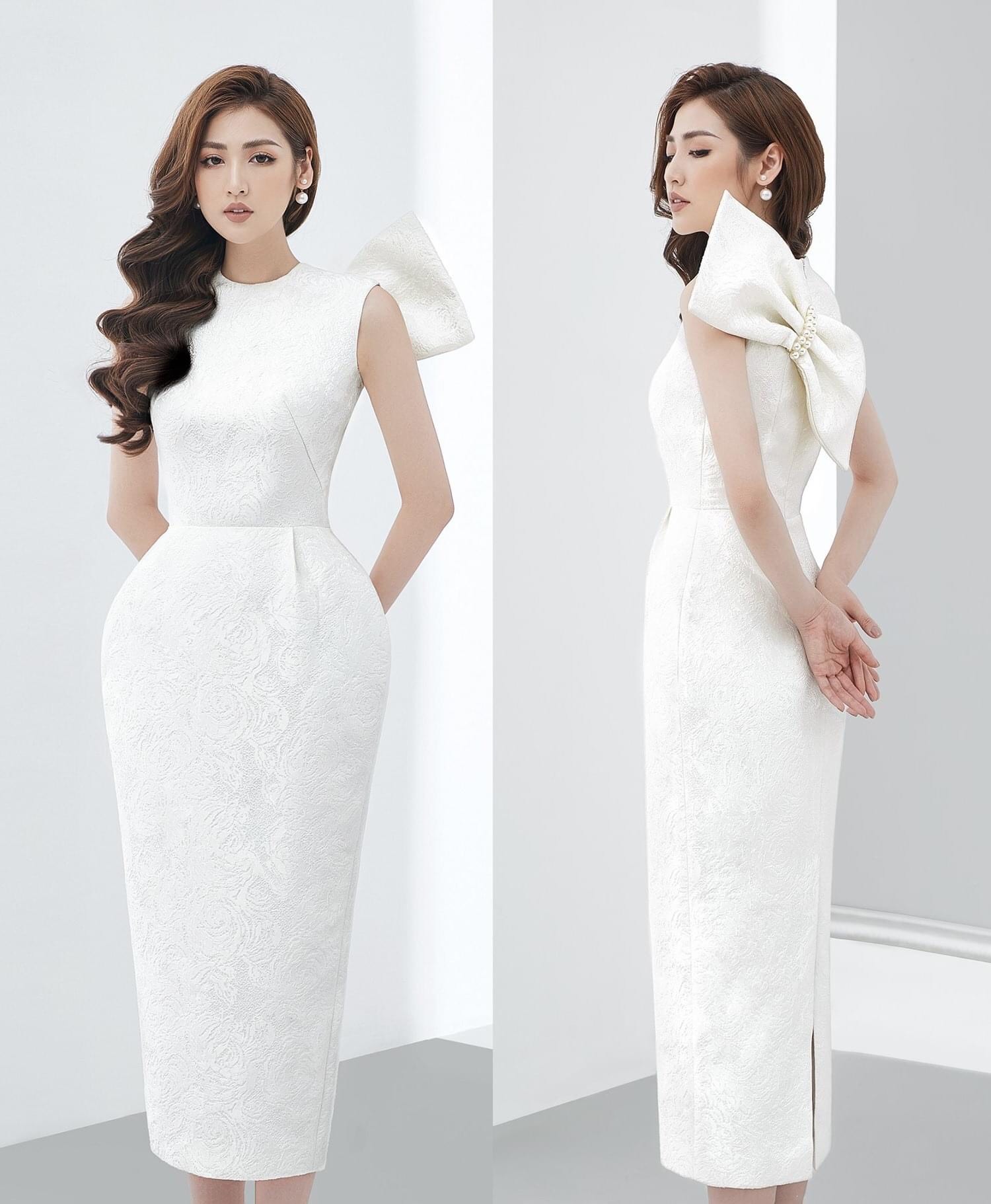 Đầm gấm ôm body sát nách nơ lưng đính ngọc