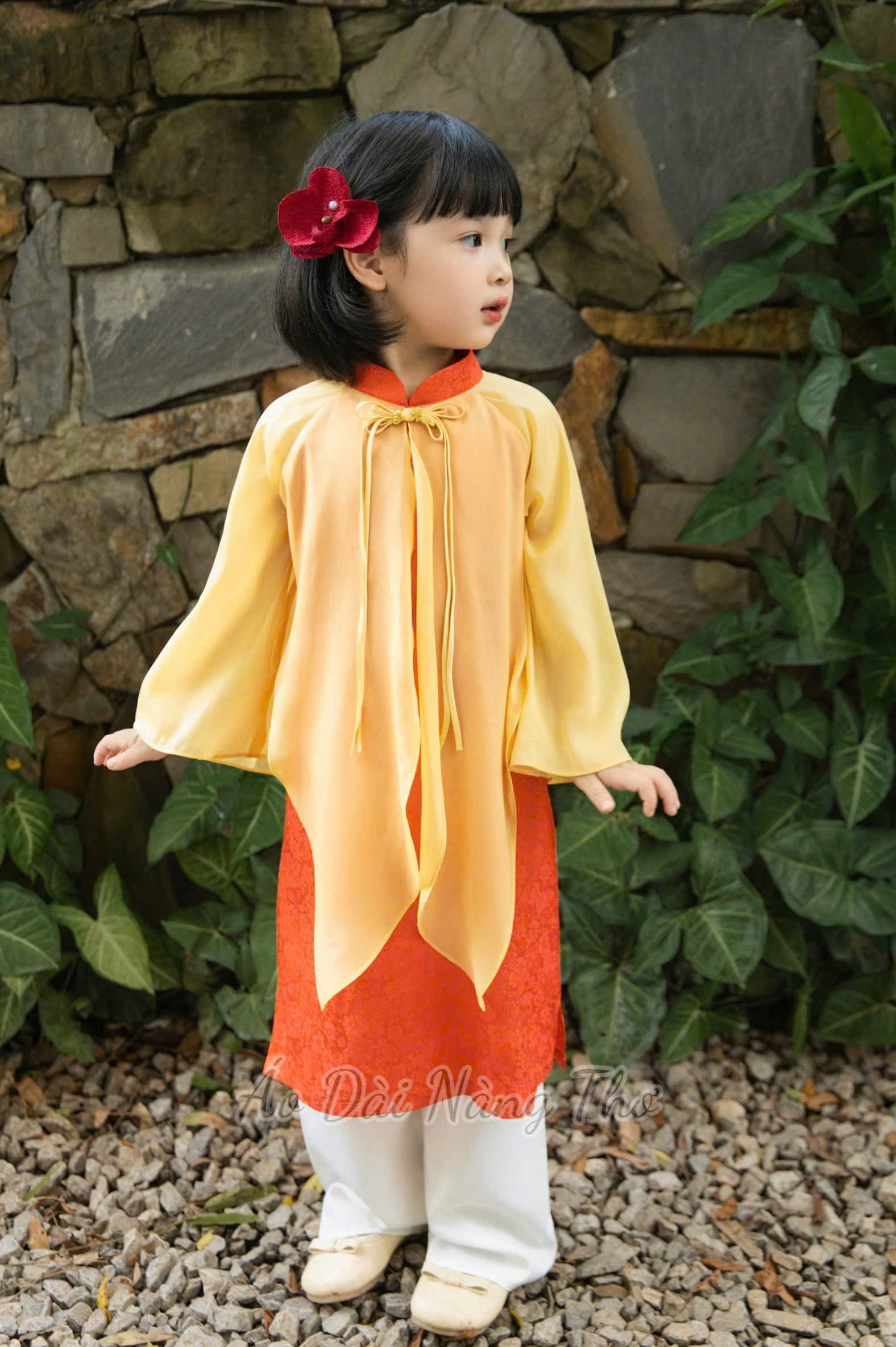 Áo Dài Bé Gái Lụa Cam Xẻ Tà Tân Thời