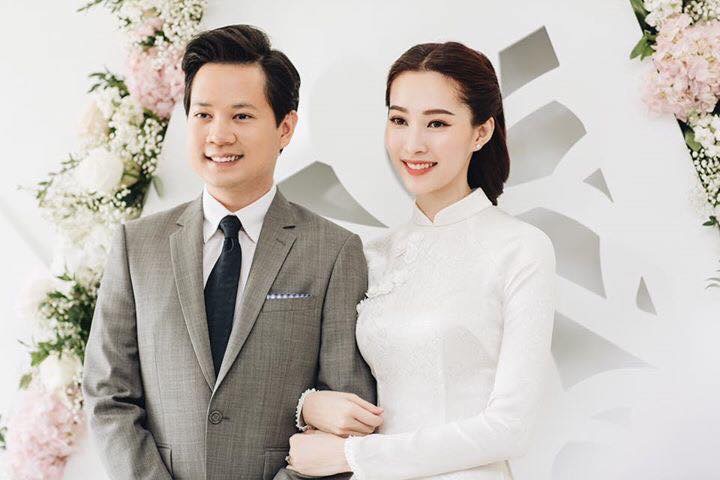 Áo dài cô dâu gấm trắng đính hoa