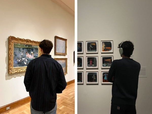 Ánh nhìn tập trung vào bức tranh trước mặt, đầu hơi nghiêng nhẹ