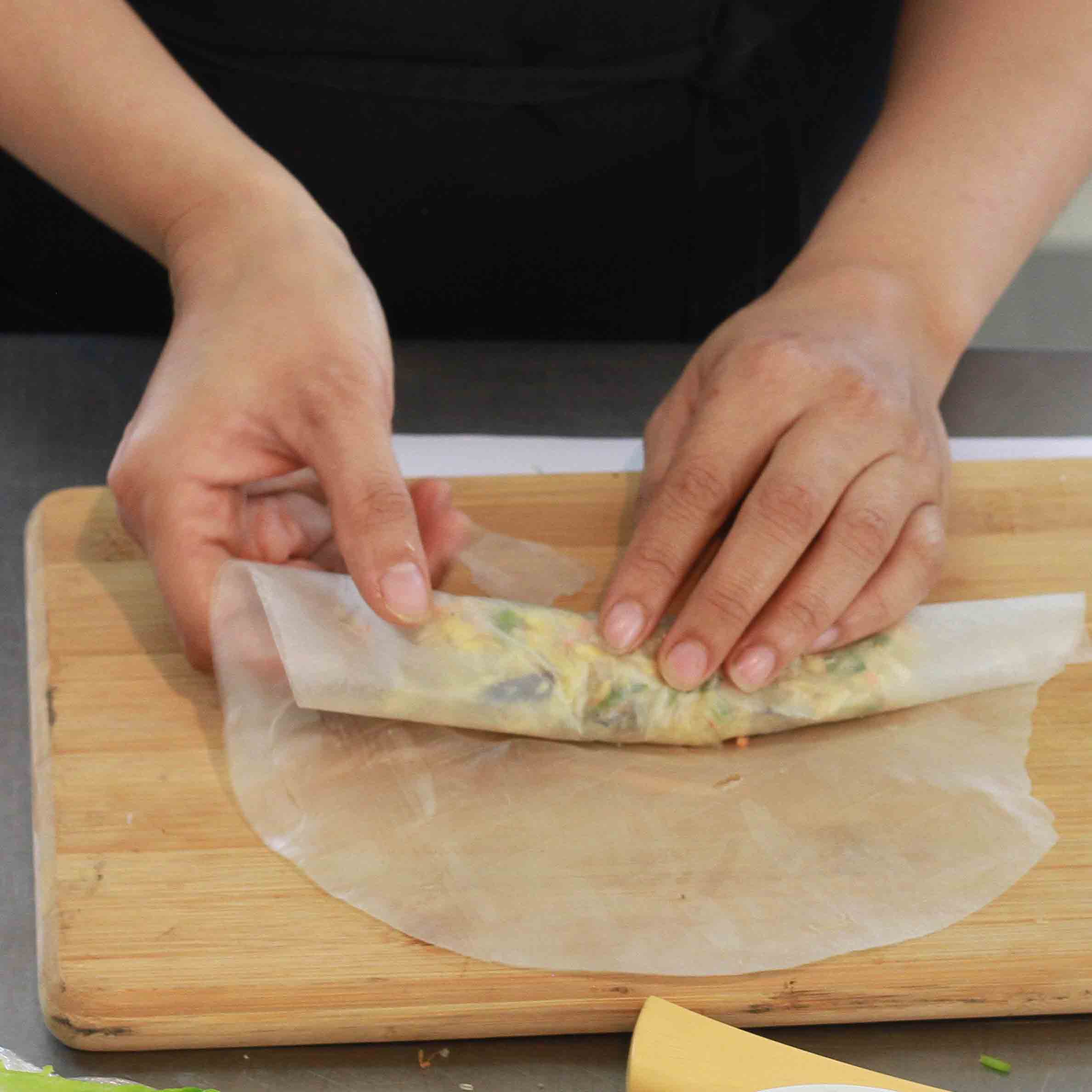 preparing fried spring roll at Hoa Sua School