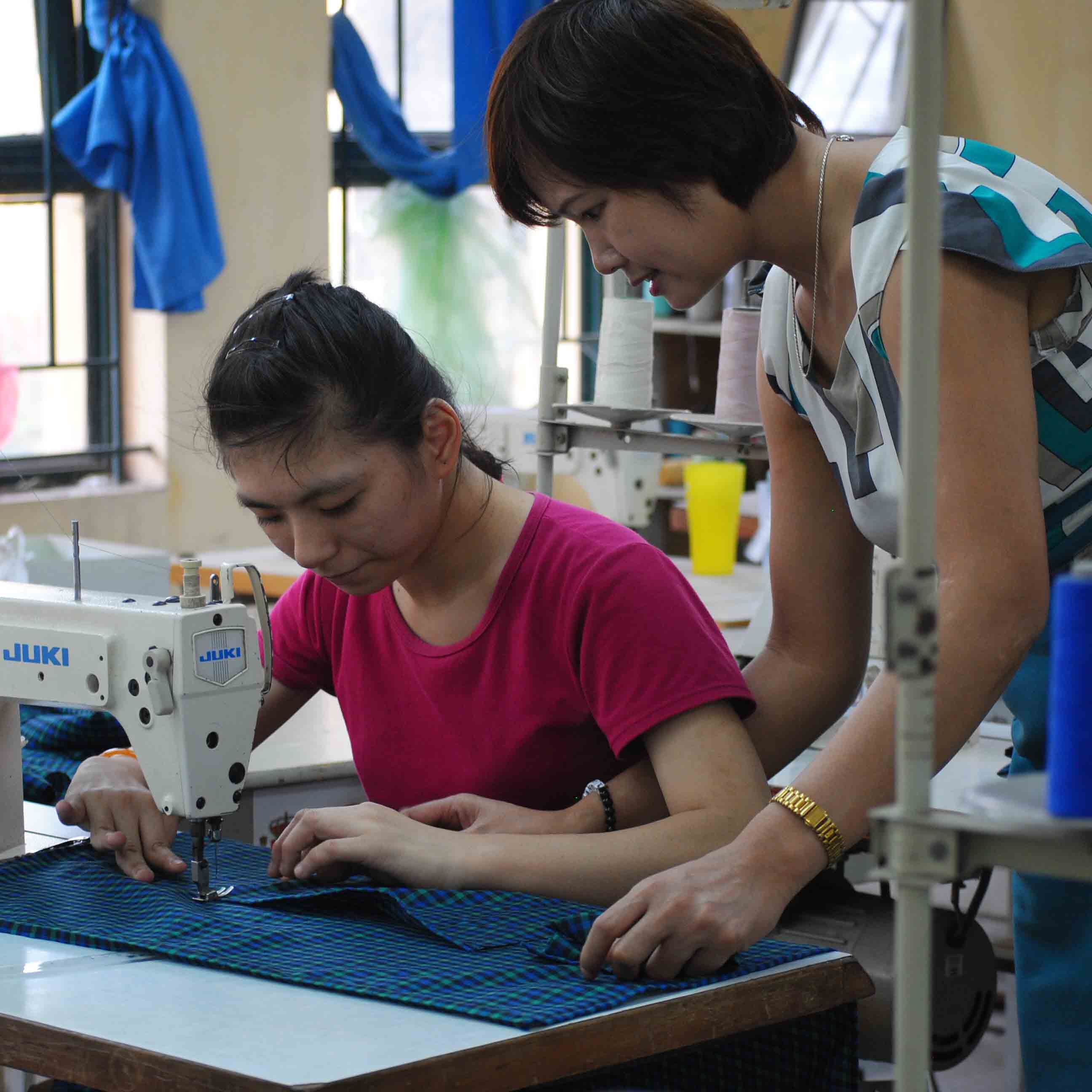 A sewing teacher and a student at Hoa Sua School