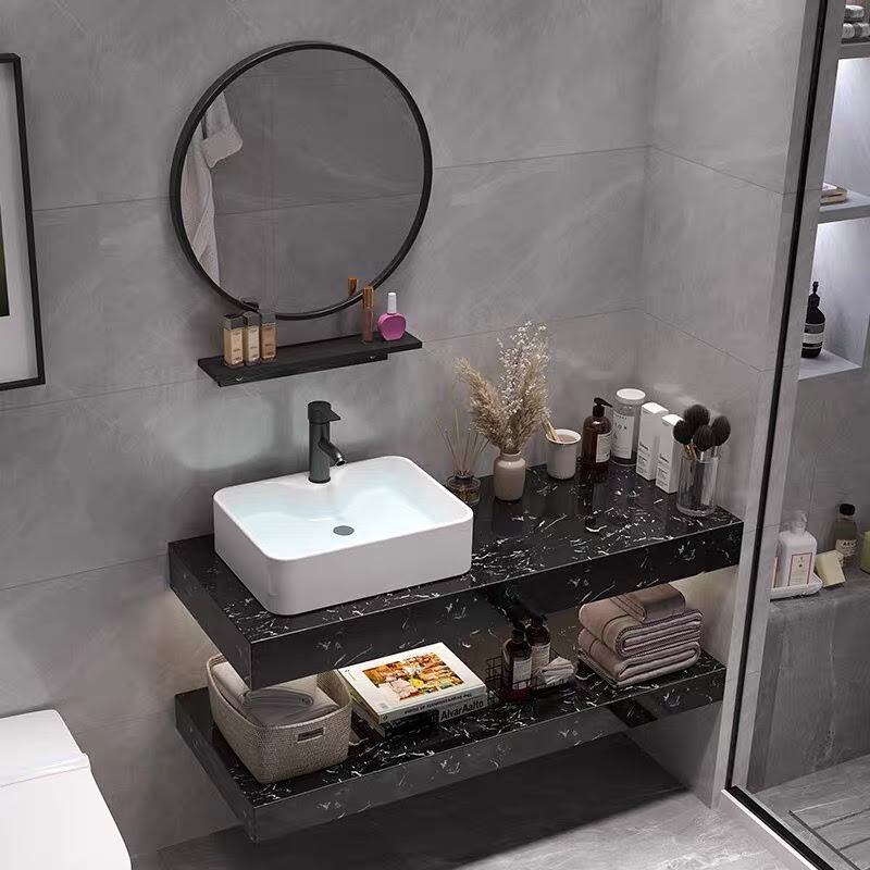 BD1010 - Bàn đá nhân tạo 2 tầng đen  vân mây, kết hợp chậu sứ nổi, vòi nóng lạnh, gương tròn viền thép đen.