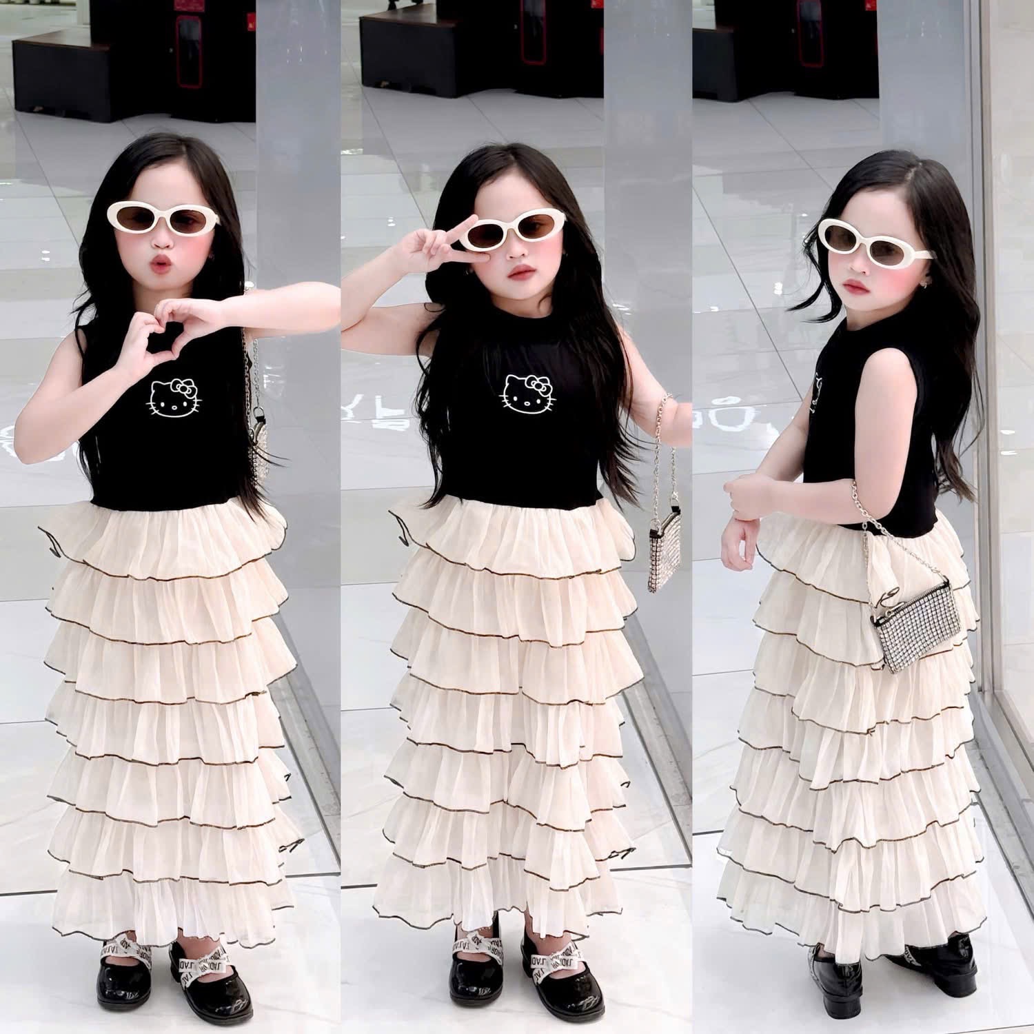 - VÁY BÉ GÁI ĐEN KITTY CHÂN BE XẾP TẦNG