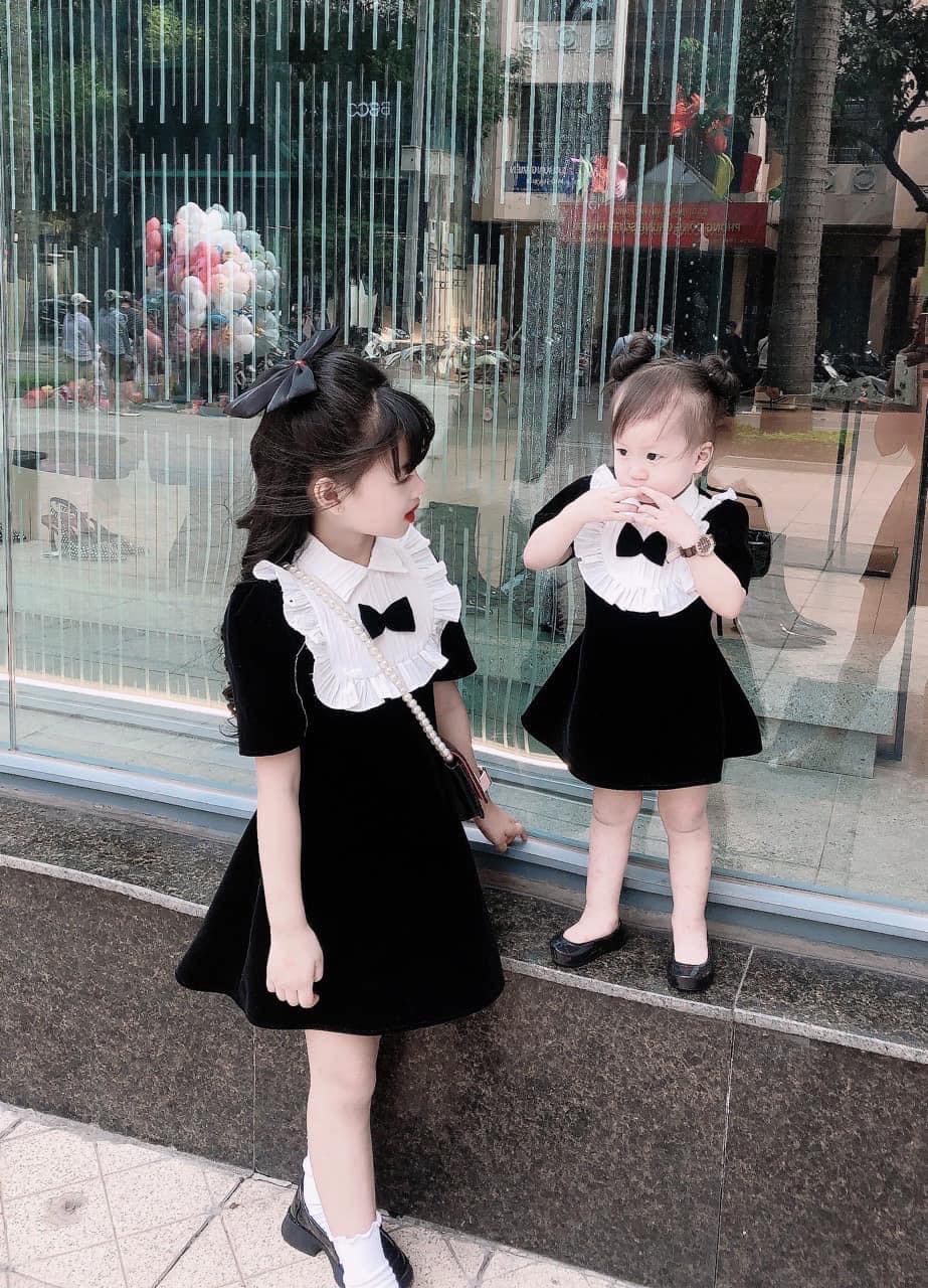 BÁN SỈ VÁY NHUNG ĐEN BÉ GÁI CỔ SƠ MI TRẮNG BÈO NƠ ĐEN