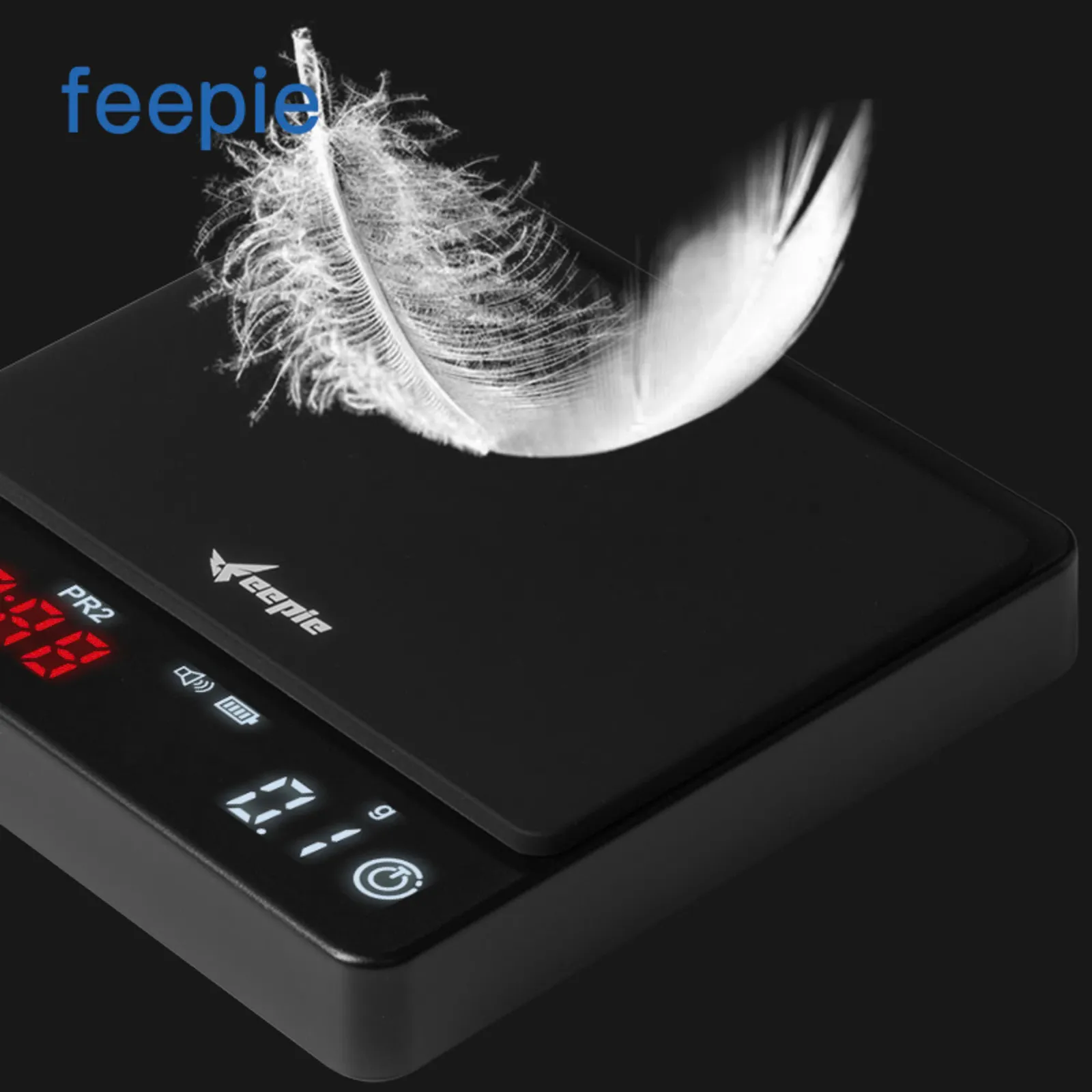 Lông vũ đặt trên mặt cân điện tử Feepie minh hoạ độ nhạy 0,1g của cảm biến