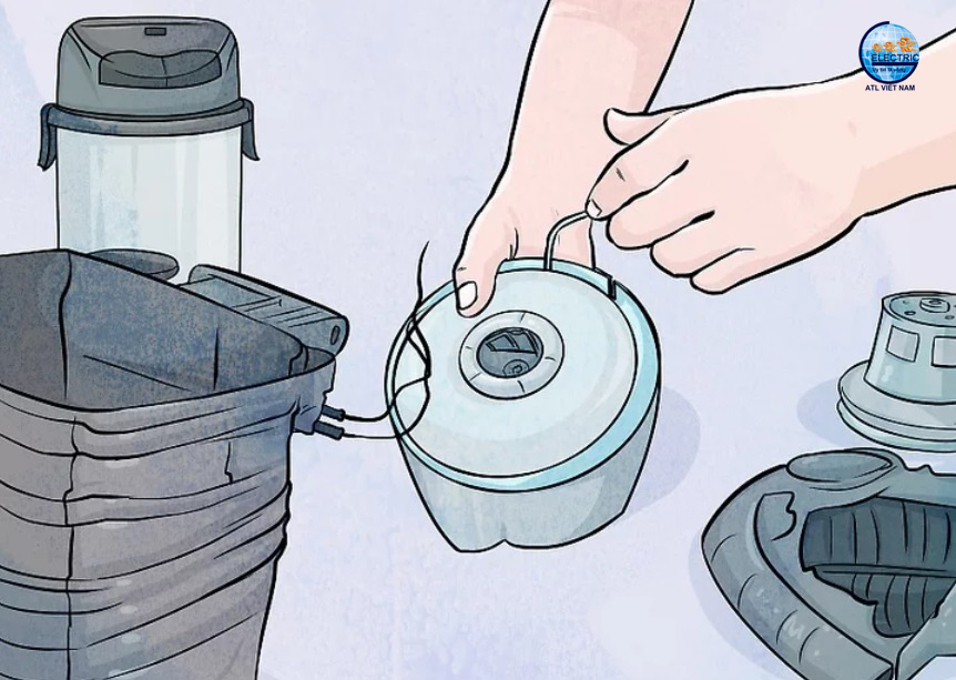 Tháo thùng chứa ra khỏi máy hút bụi