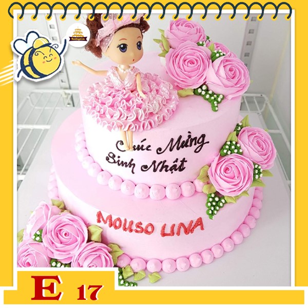 Bánh kem búp bê E17 váy hồng ngồi trên bánh 2 tầng nhiều bông hoa màu hồng xinh xắn