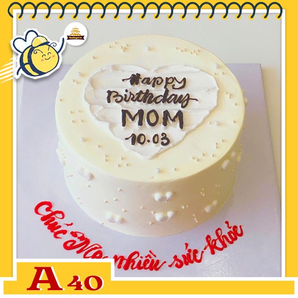 Bánh kem sinh nhật đơn giản A40 màu vàng nhạt kem ở giữa có trái tim màu trắng ấn tượng