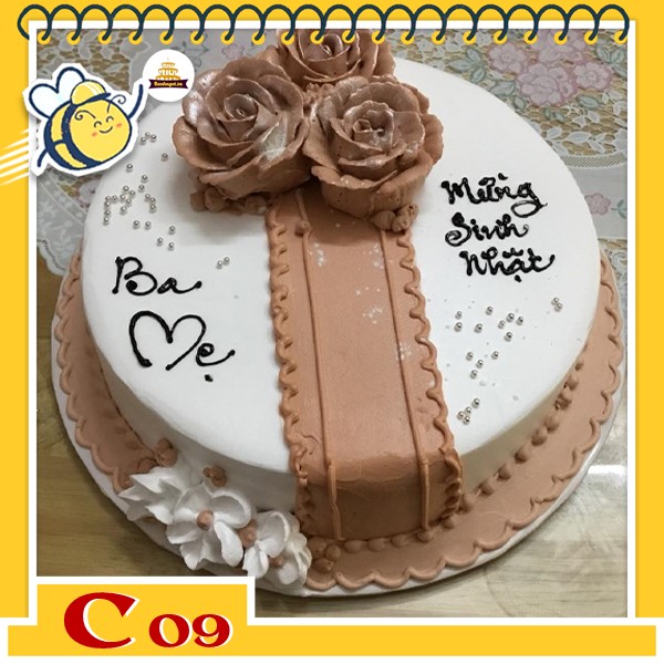 Bánh kem tặng cha C09 màu nâu trắng với đóa hoa tạo thành hình chiếc nơ ruy băng bằng hoa ấn tượng
