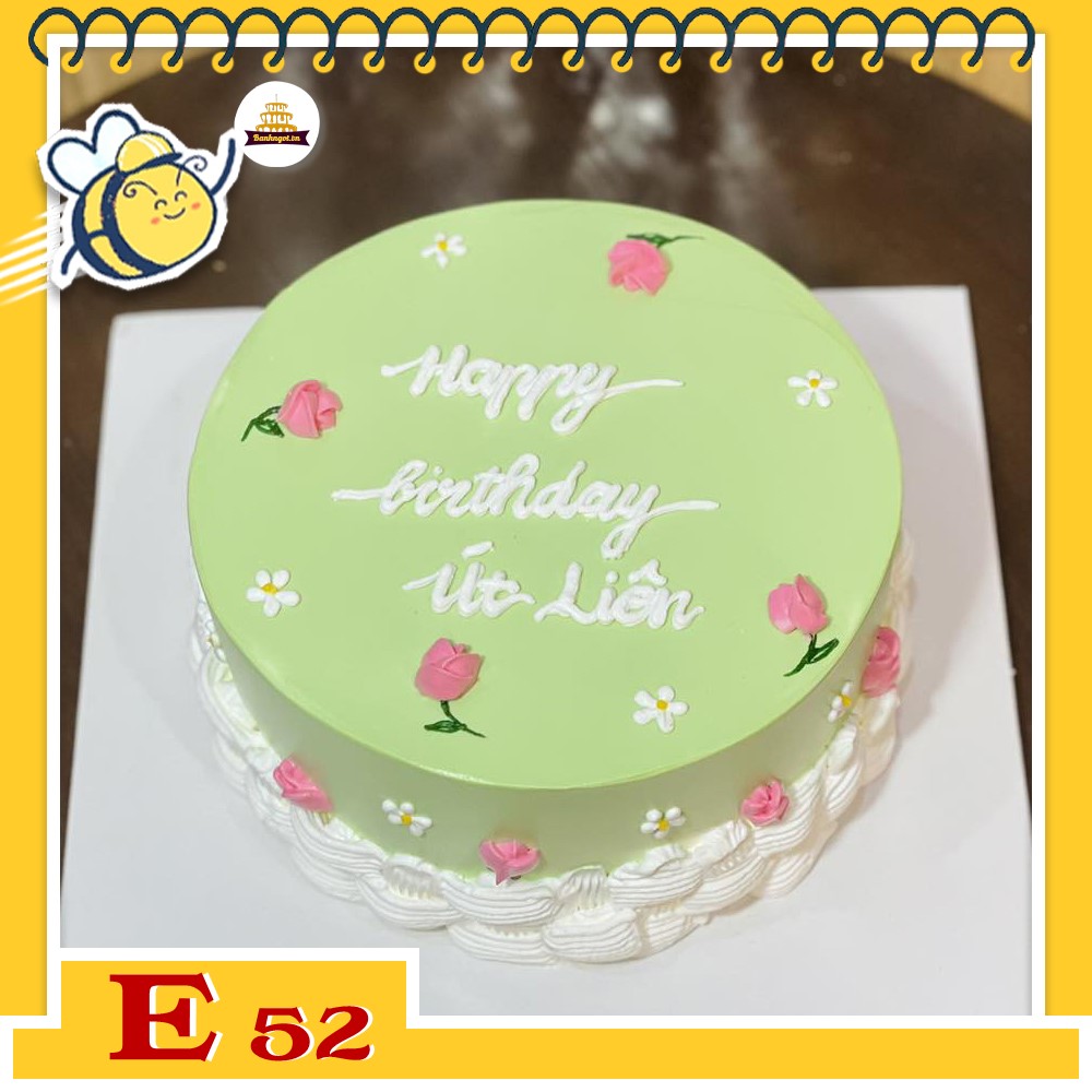 Bánh kem E52 nền xanh lá vẽ nhiều bông hoa màu hồng xung quanh cho nữ