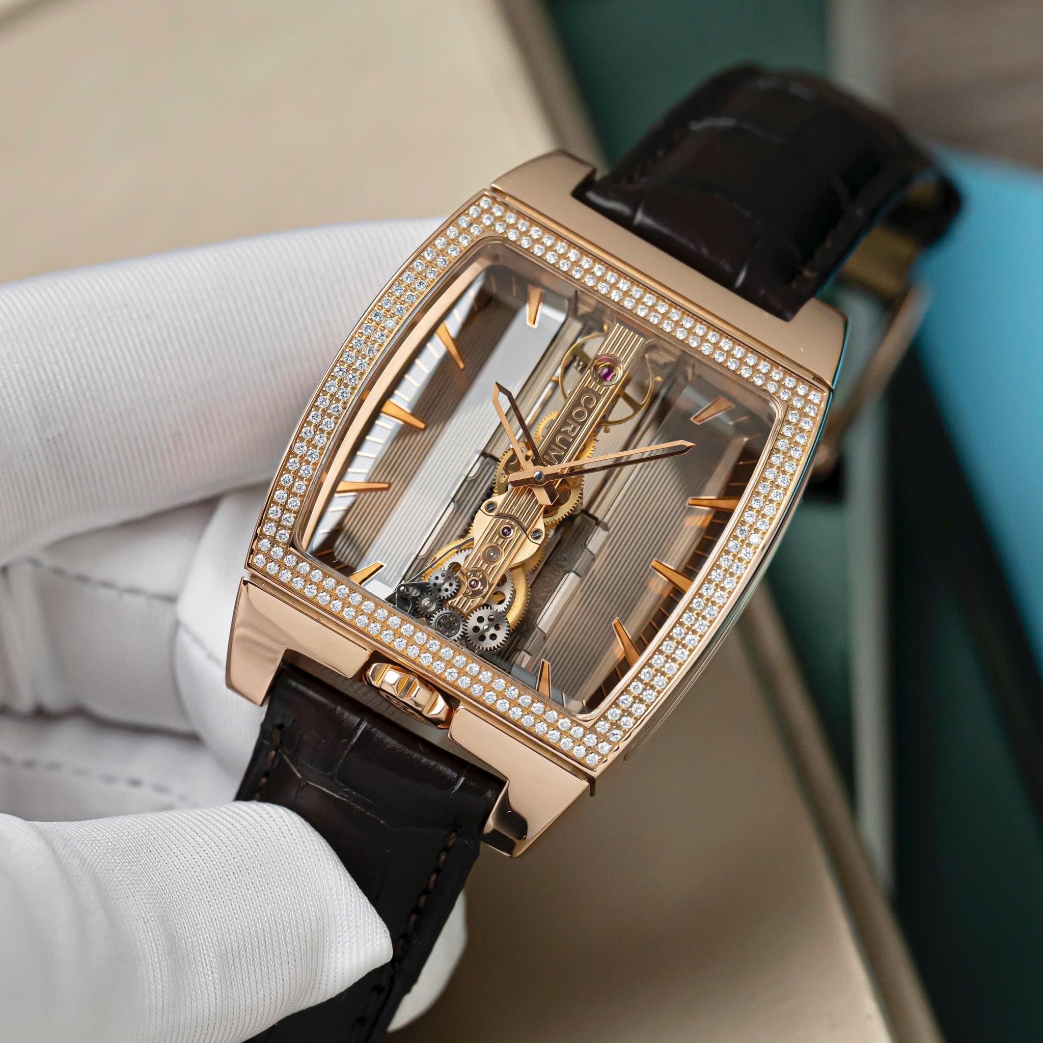 corum-golden-bridge-automatic-in-rose-gold-with-diamond-bezel-on-brown-crocodile