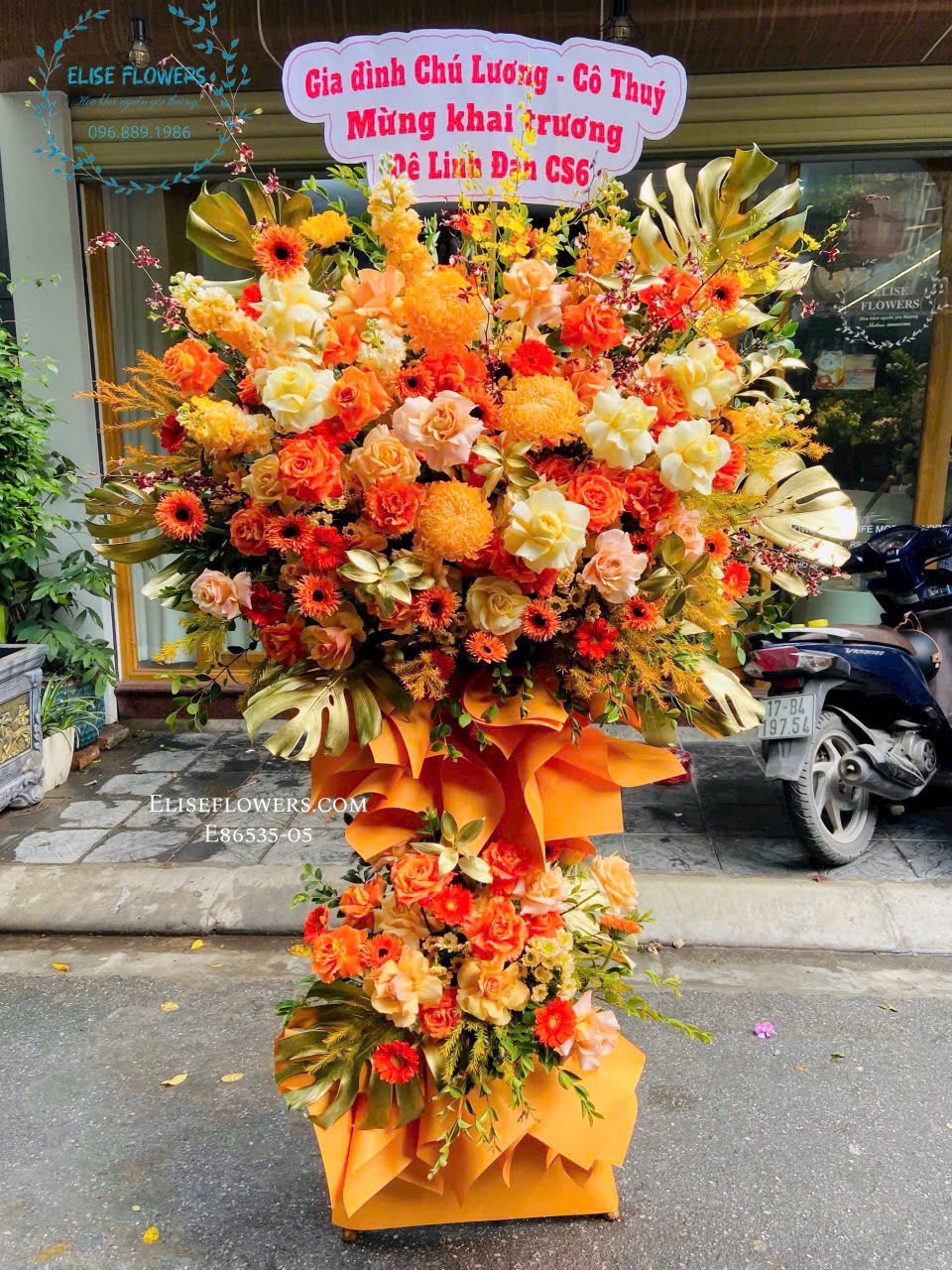 Hoa khai trương tone cam rưc rỡ. Shop hoa uy tín Eliseflowers