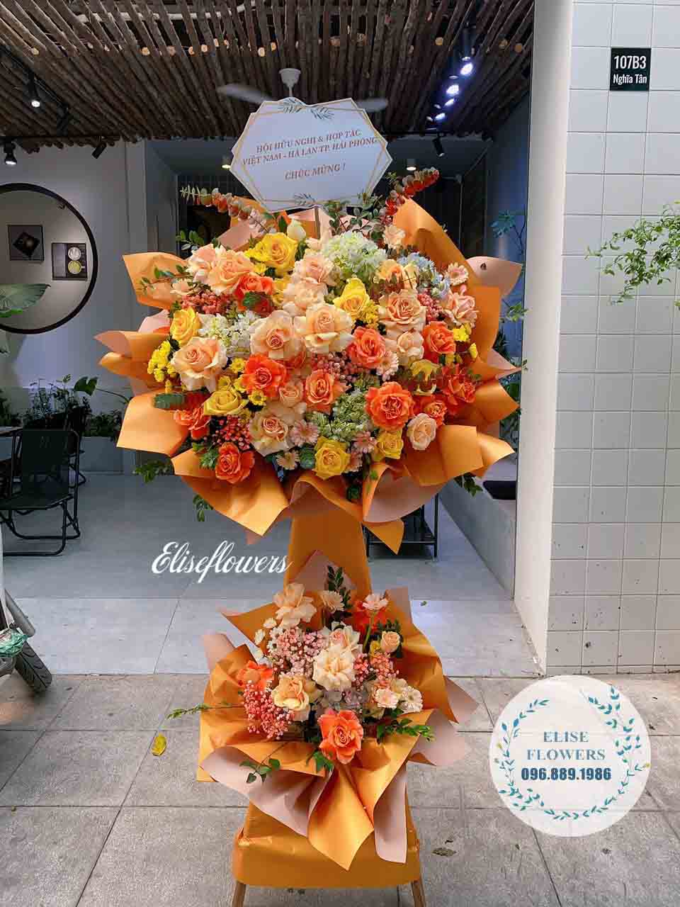 Kệ hoa 2 tầng chuc mừng sự kiện màu cam nổi bật | Kệ hoa chúc mừng ý nghĩa tại Hà Nội