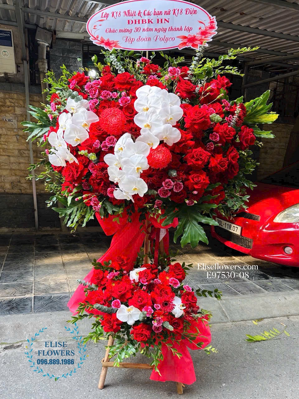 Mua kệ hoa đỏ mix hoa lan hồ điệp chúc mừng sự kiện. Shop hoa tươi Eliseflowers