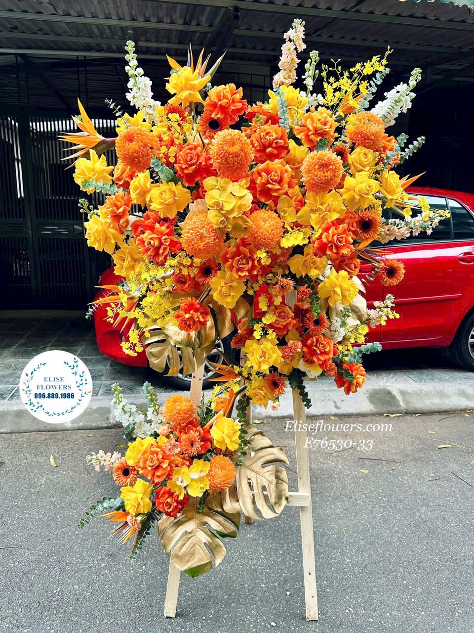 Hoa khai trương Hà Nội. Kệ khai trương tone cam phú quý, tài lộc. Eliseflowers