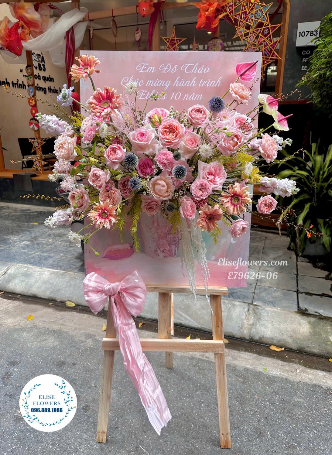 Kệ Khung Tranh Tone Hồng Mừng Kỉ Niệm Thành Lập Tại Hà Nội| Eliseflowers- Dịch Vụ Cung Cấp Hoa Tươi, Lan Hồ Điệp Cao Cấp Tại Hà Nội