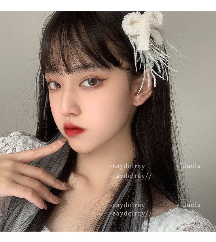 Kẹp tóc nơ lông chim trắng