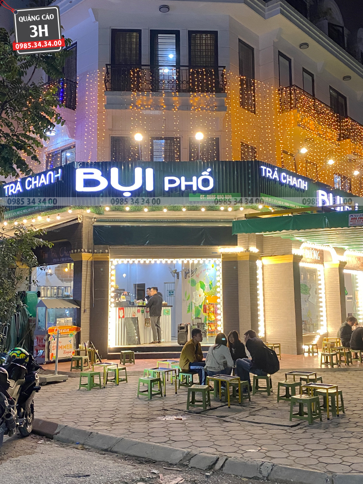 biển quảng cáo tiệm chà tranh bụi phố sáng đèn
