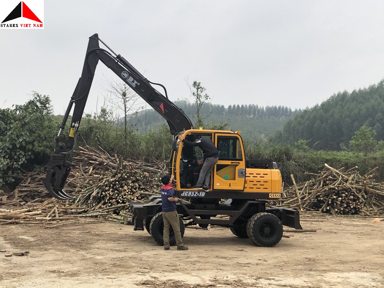 Máy xúc đào bánh lốp gắp gỗ Jinggong Trung Quốc