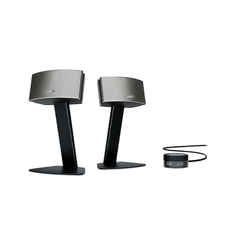 Bose Companion 50 loa vệ tinh đặt trên chân đứng kim loại, cạnh đó là control pod điều chỉnh âm lượng | Đại Nam Sky Music