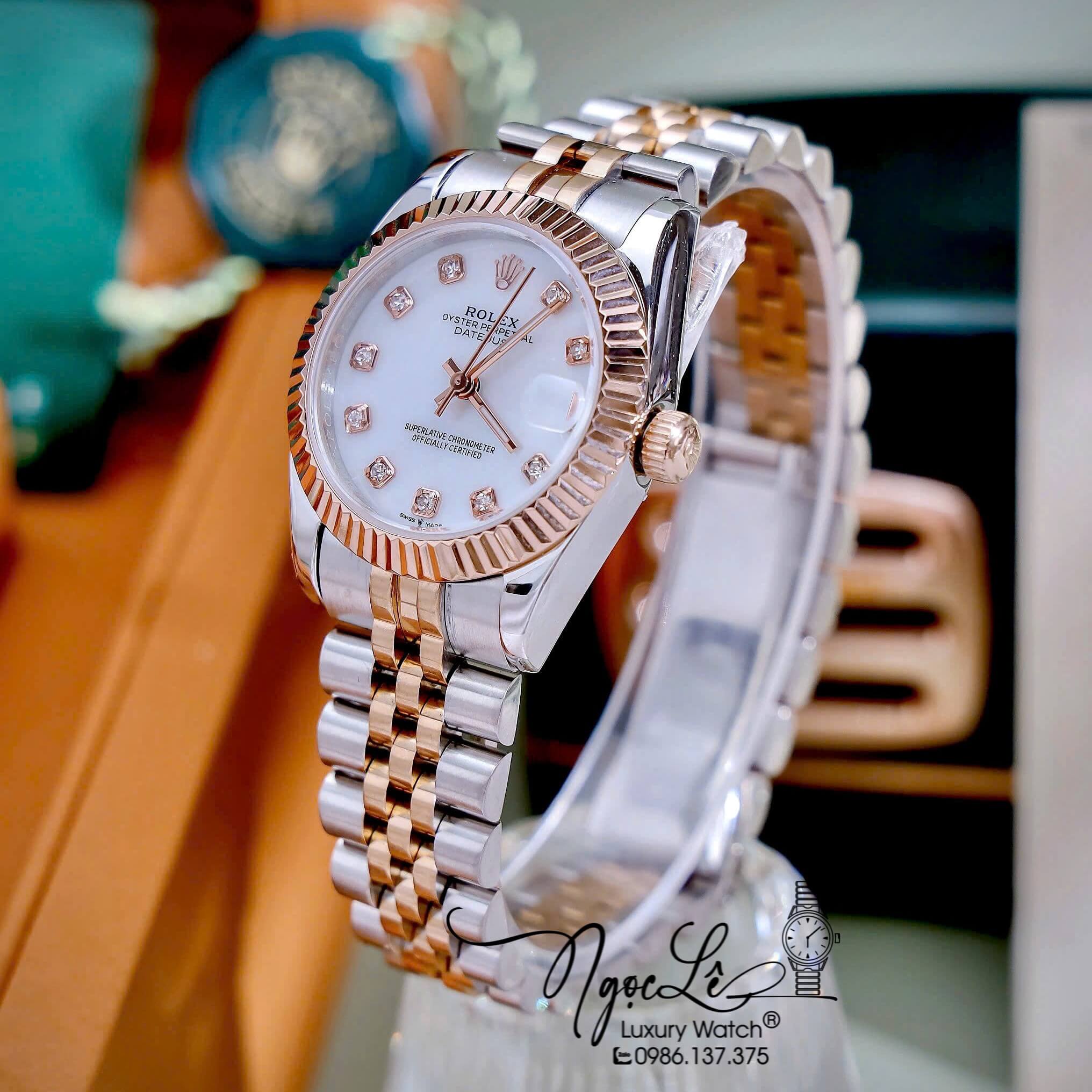 Đồng Hồ Nữ Rolex Datejust Máy Pin Dây Demi Rose Mặt Trắng Xà Cừ Niềng Khía Size 31mm
