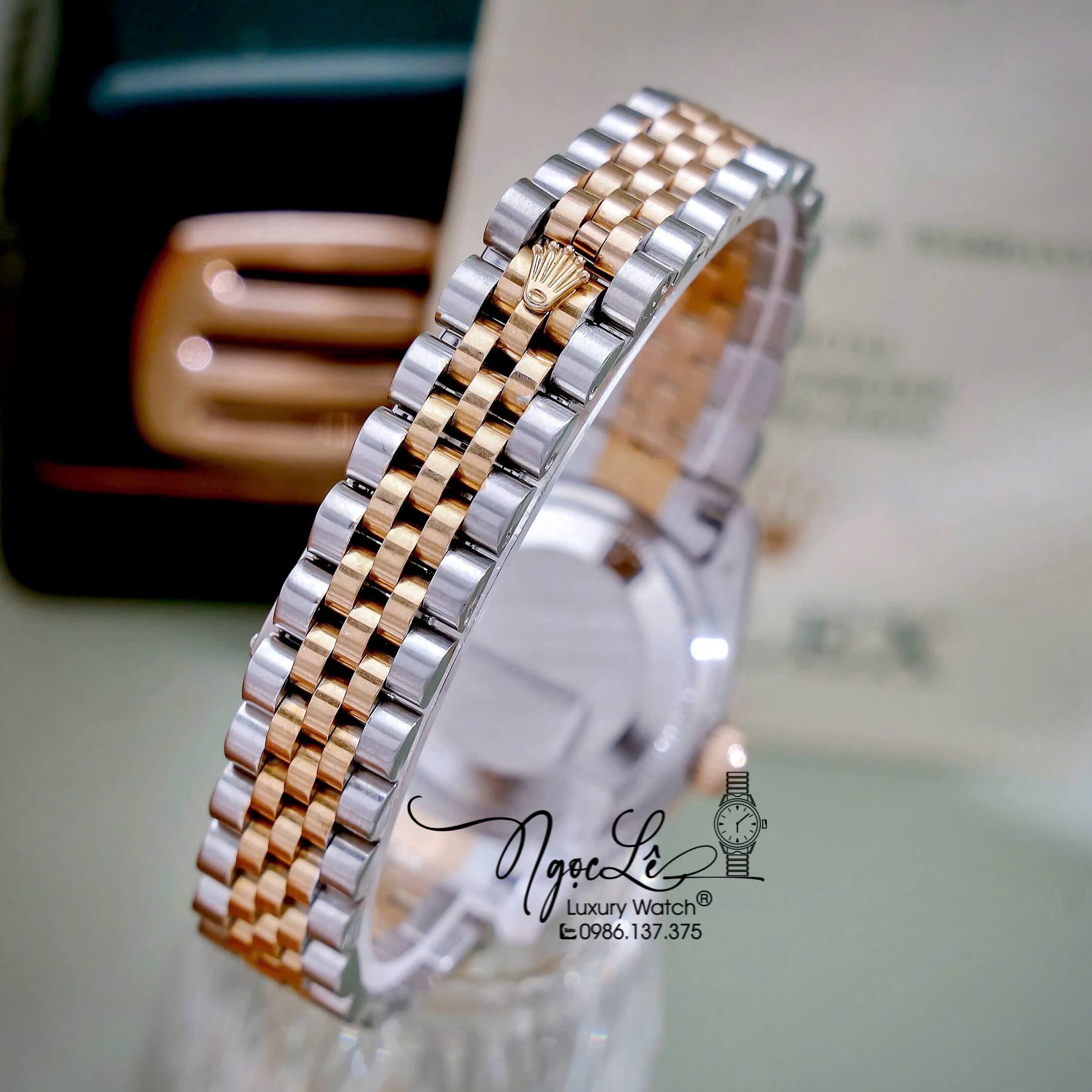 Đồng Hồ Nữ Rolex Datejust Máy Pin Dây Demi Rose Mặt Trắng Xà Cừ Niềng Khía Size 31mm