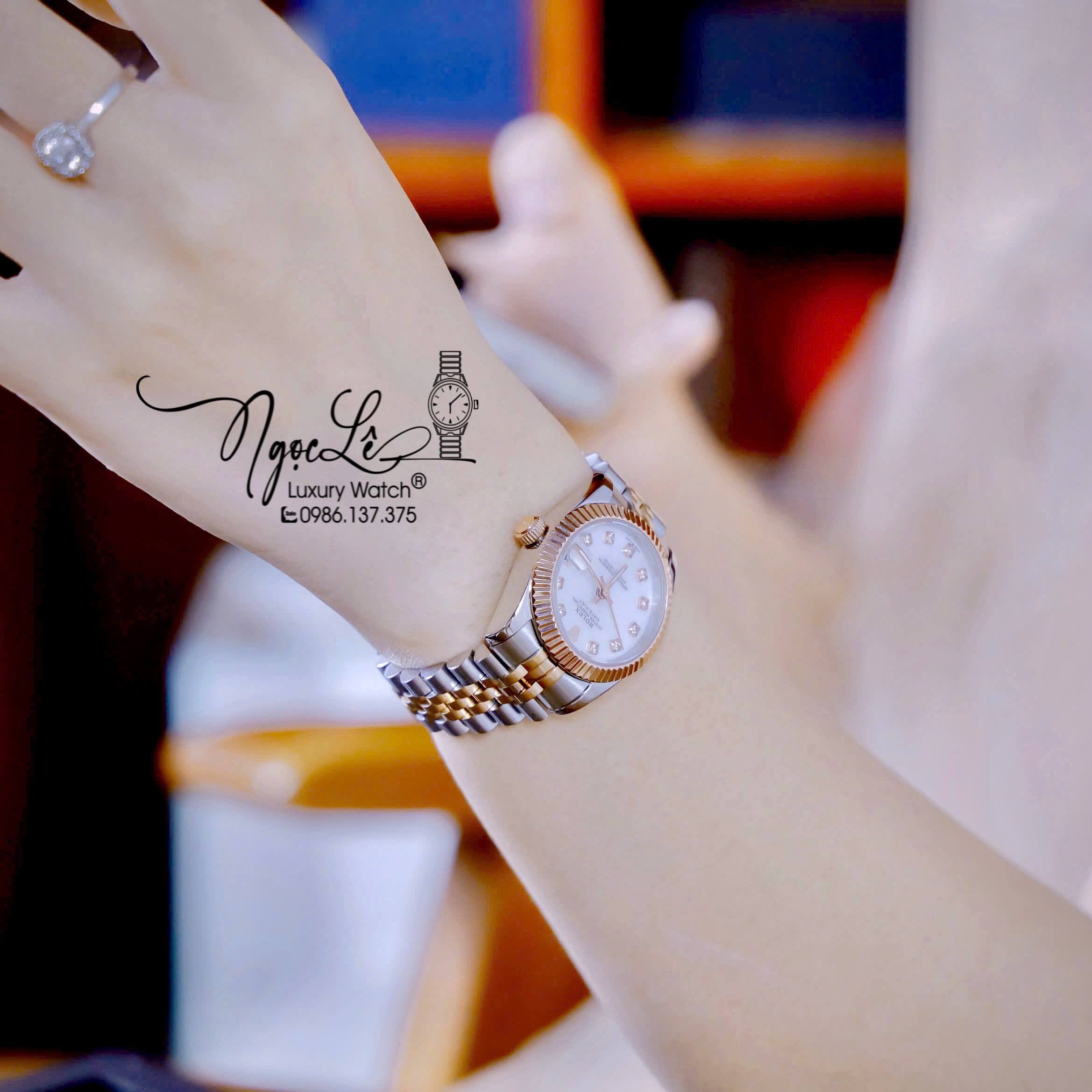 Đồng Hồ Nữ Rolex Datejust Máy Pin Dây Demi Rose Mặt Trắng Xà Cừ Niềng Khía Size 31mm