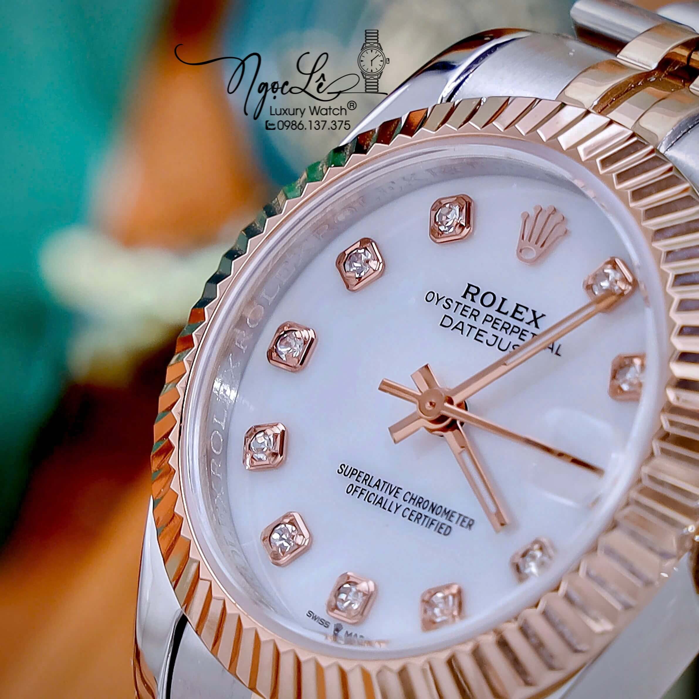 Đồng Hồ Nữ Rolex Datejust Máy Pin Dây Demi Rose Mặt Trắng Xà Cừ Niềng Khía Size 31mm