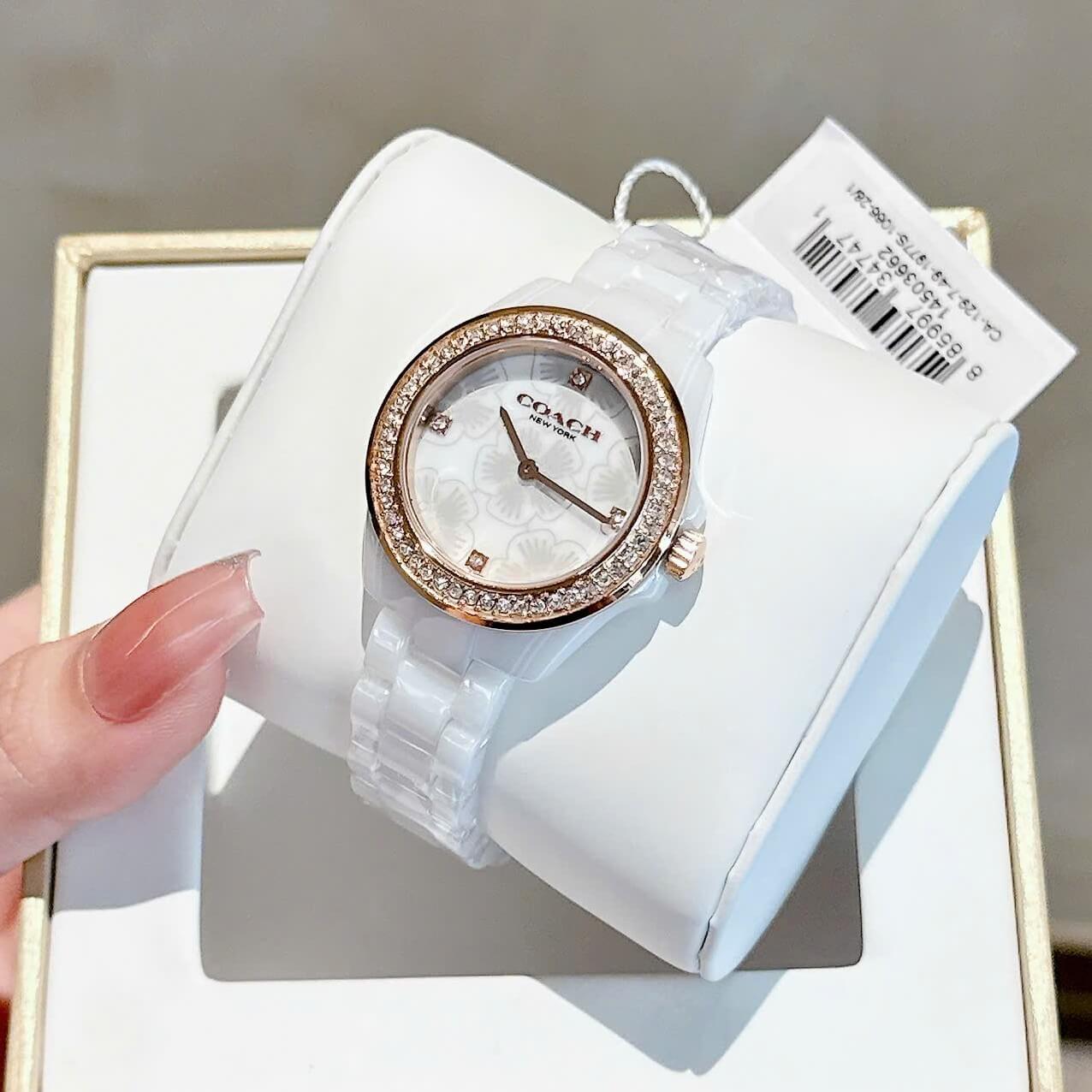 Đồng Hồ Nữ Coach Ceramic Trắng Viền Đá Mặt Họa Tiết Hoa Trà Size 33mm Vỏ Rose Quartz