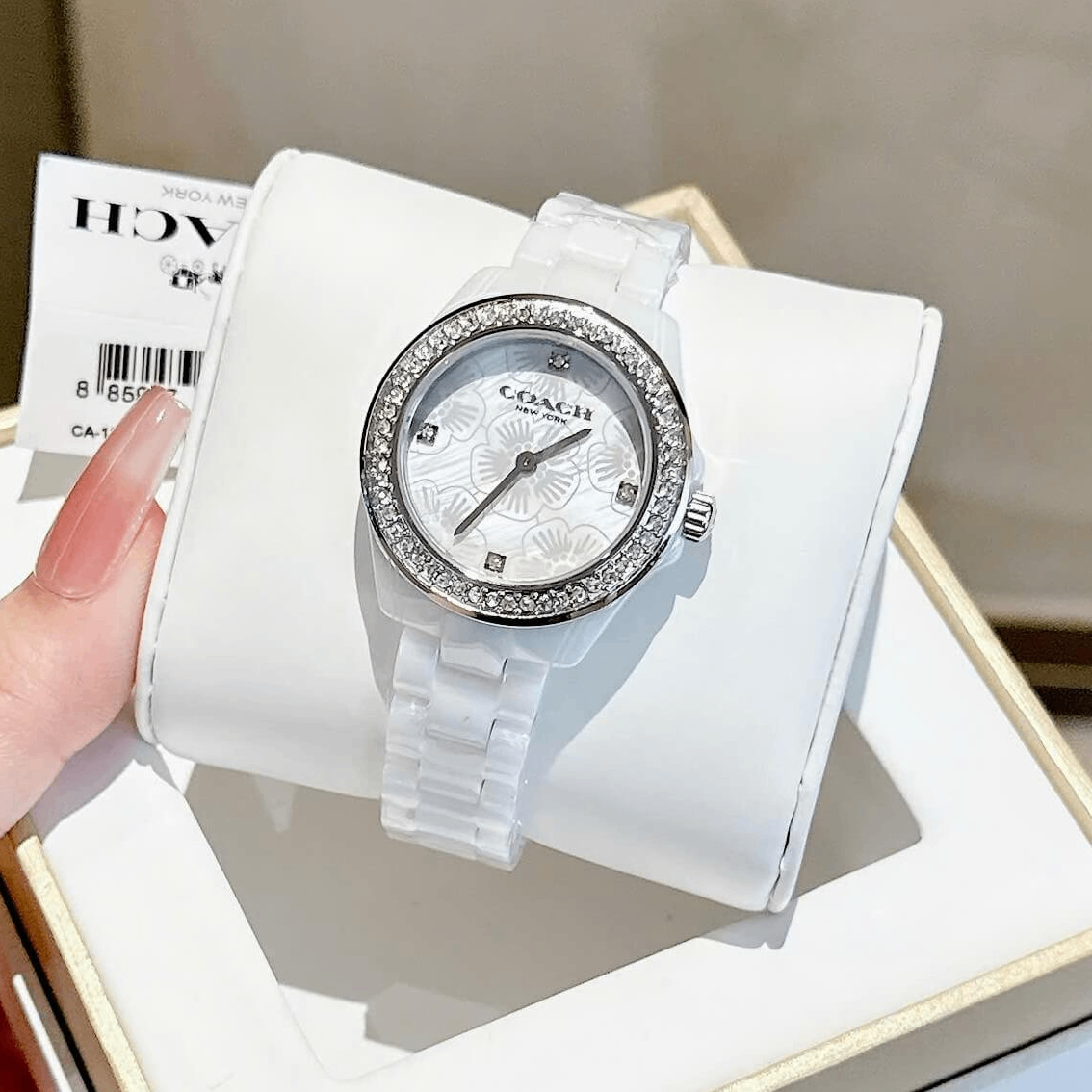 Đồng Hồ Nữ Coach Ceramic Trắng Viền Đá Mặt Họa Tiết Hoa Trà Size 33mm Vỏ Silver Quartz