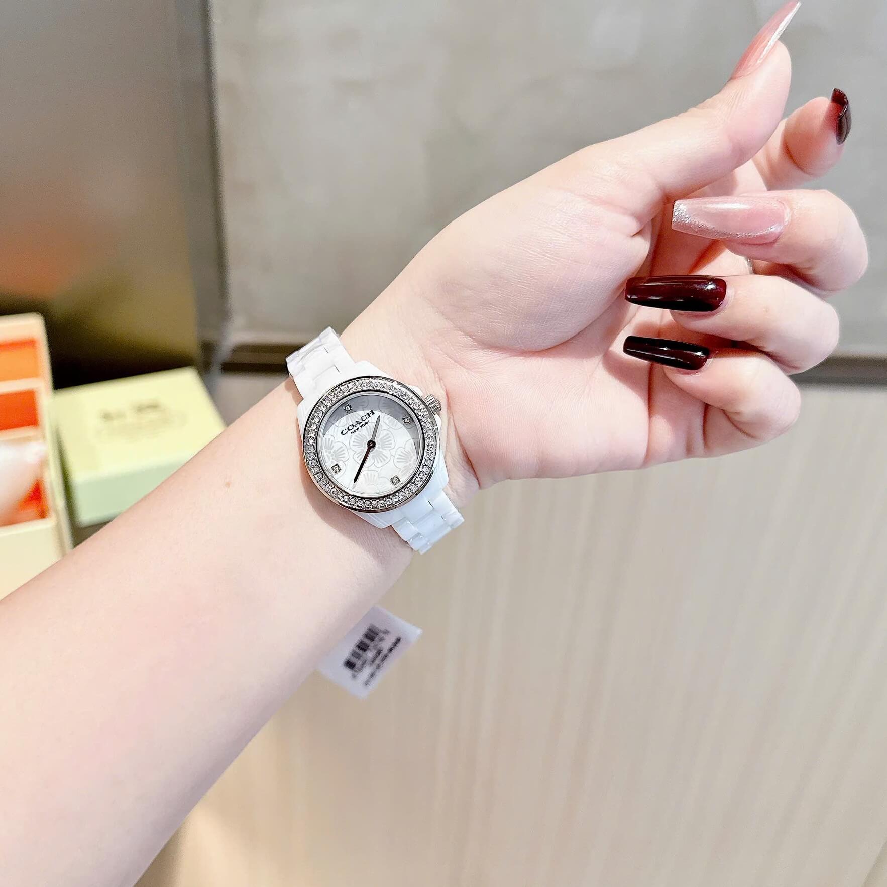 Đồng Hồ Nữ Coach Ceramic Trắng Viền Đá Mặt Họa Tiết Hoa Trà Size 33mm Vỏ Silver Quartz