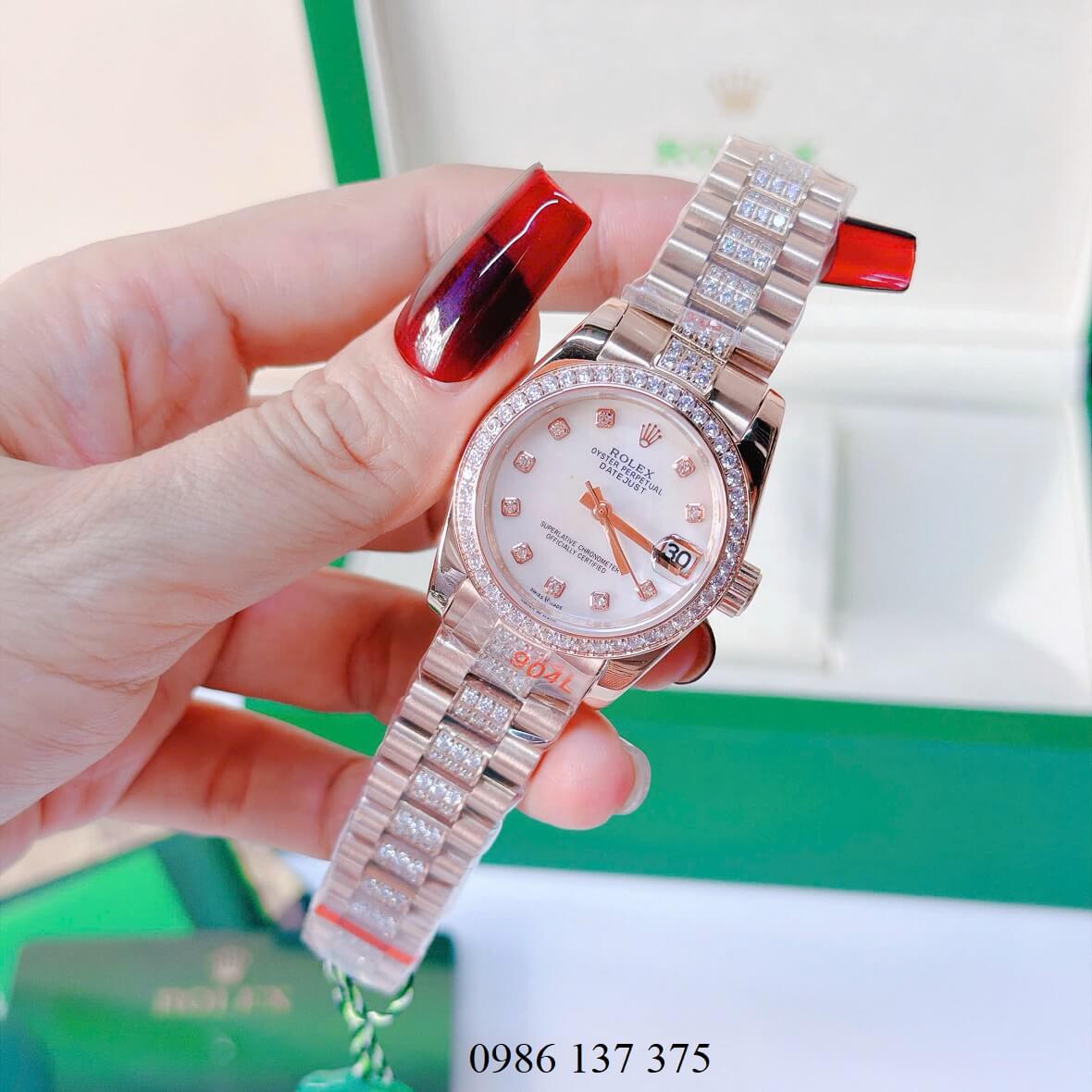 Đồng Hồ Nữ Rolex Datejust Viền Đá Mặt Trắng Xà Cừ Dây Kim Loại Vàng Hồng Đính Đá Size 31mm