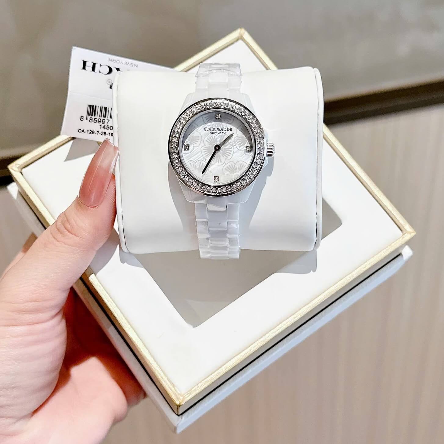 Đồng Hồ Nữ Coach Ceramic Trắng Viền Đá Mặt Họa Tiết Hoa Trà Size 33mm Vỏ Silver Quartz