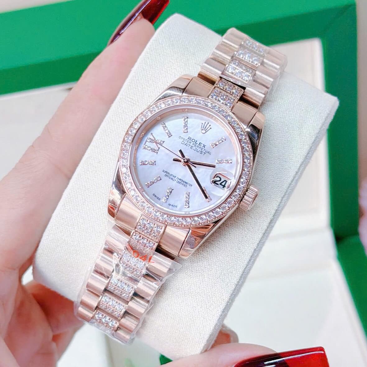Đồng Hồ Nữ Rolex Datejust Viền Đá Mặt Trắng Xà Cừ Dây Kim Loại Vàng Hồng Đính Đá Size 31mm