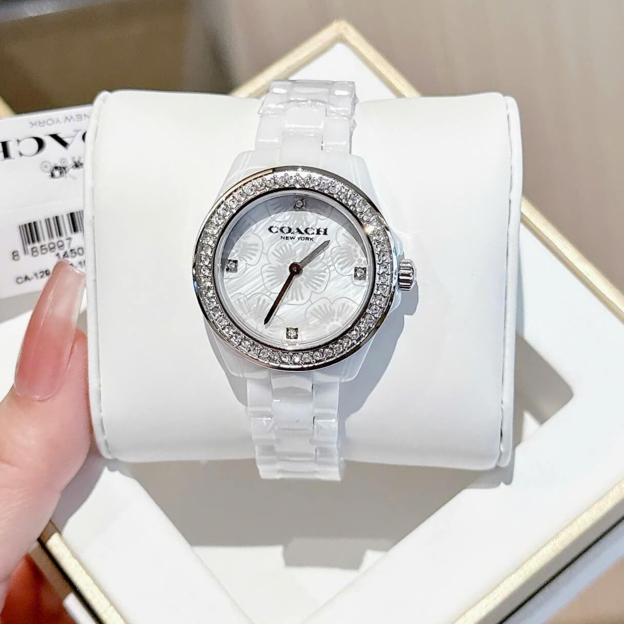 Đồng Hồ Nữ Coach Ceramic Trắng Viền Đá Mặt Họa Tiết Hoa Trà Size 33mm Vỏ Silver Quartz
