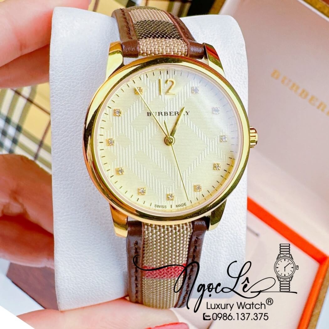 Đồng Hồ Burberry Nữ Dây Da Kẻ Sọc Caro Màu Nâu Mặt Vàng Size 32mm