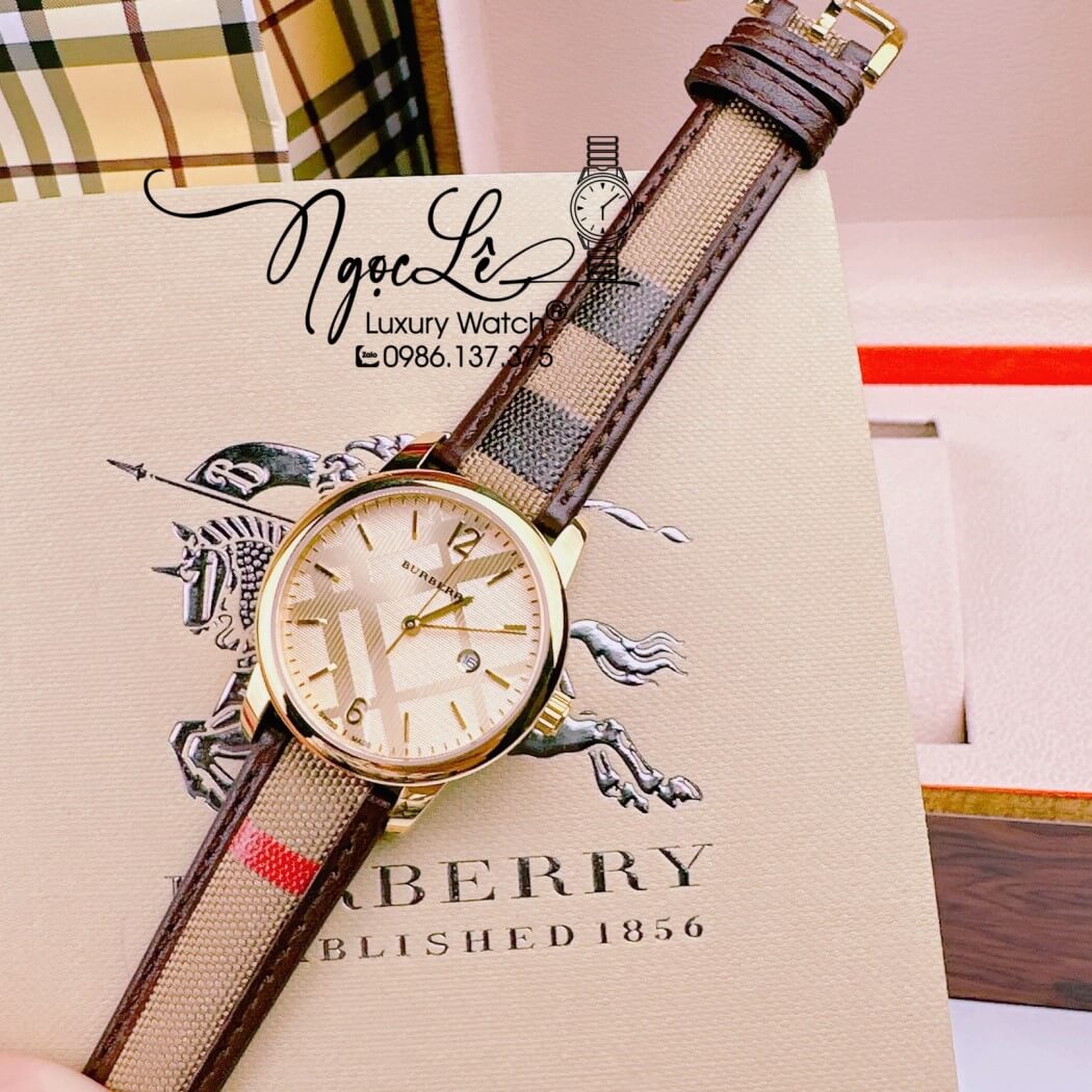 Đồng Hồ Burberry Nữ Dây Da Kẻ Sọc Caro Màu Nâu Mặt Vàng Size 32mm