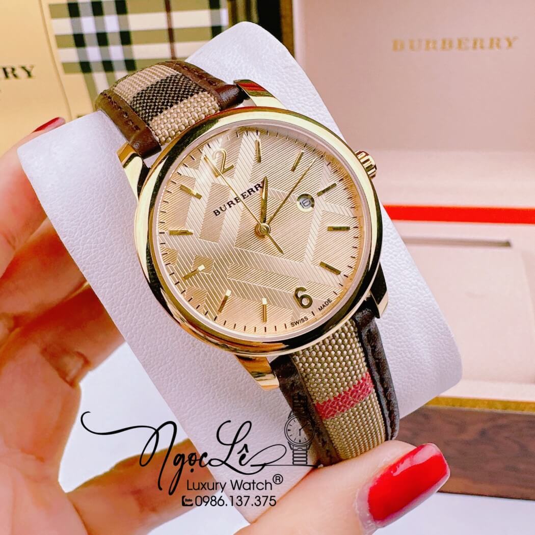 Đồng Hồ Burberry Nữ Dây Da Kẻ Sọc Caro Màu Nâu Mặt Vàng Size 32mm