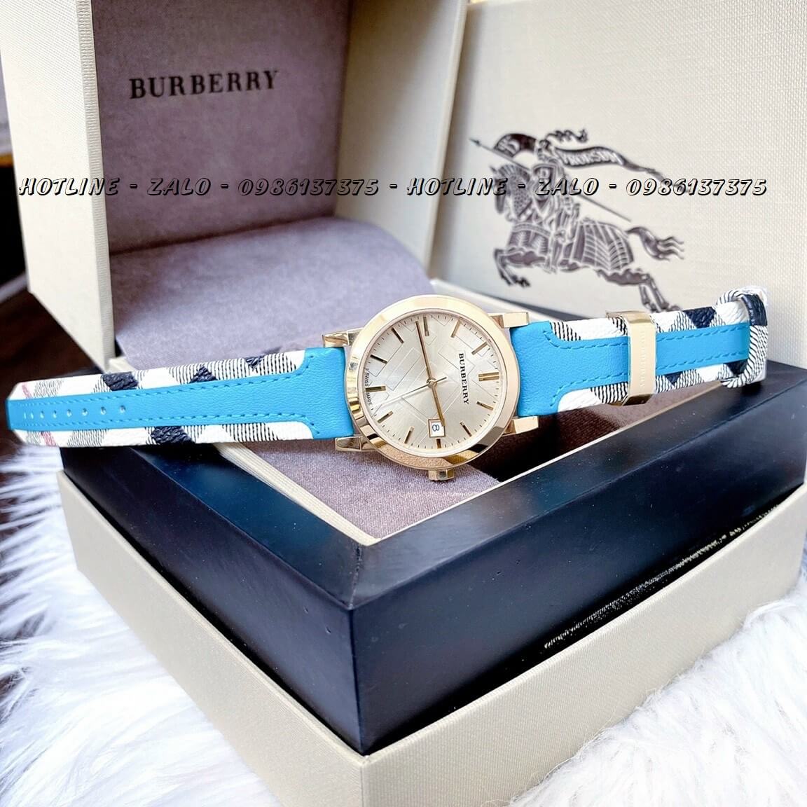 Đồng Hồ Burberry Nữ Dây Da Xanh Bọc Caro 34mm