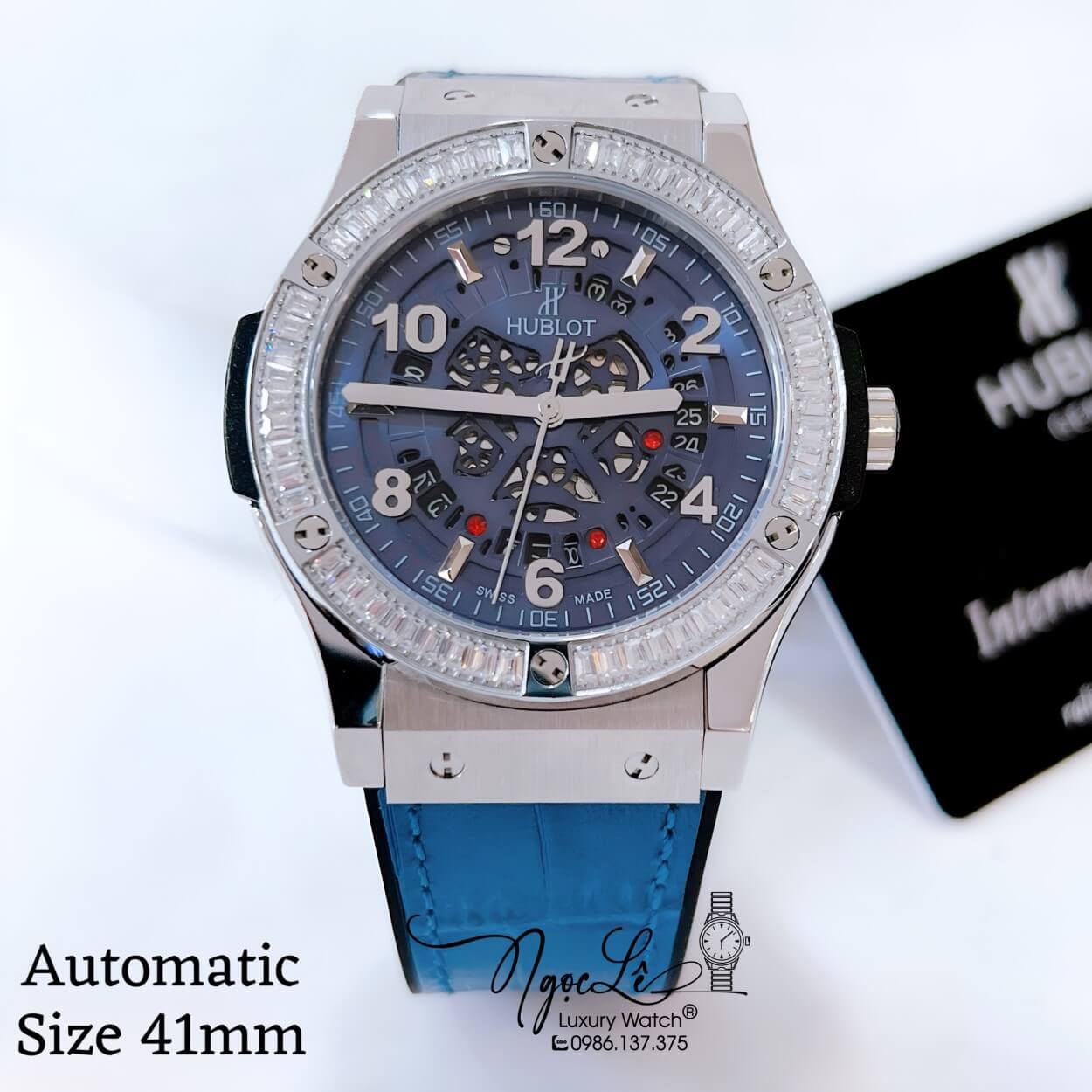 Đồng Hồ Hublot Nam Tự Động Lộ Máy Dây Da Silicon Xanh Navy Đính Đá Ống Vỏ Silver Size 41mm