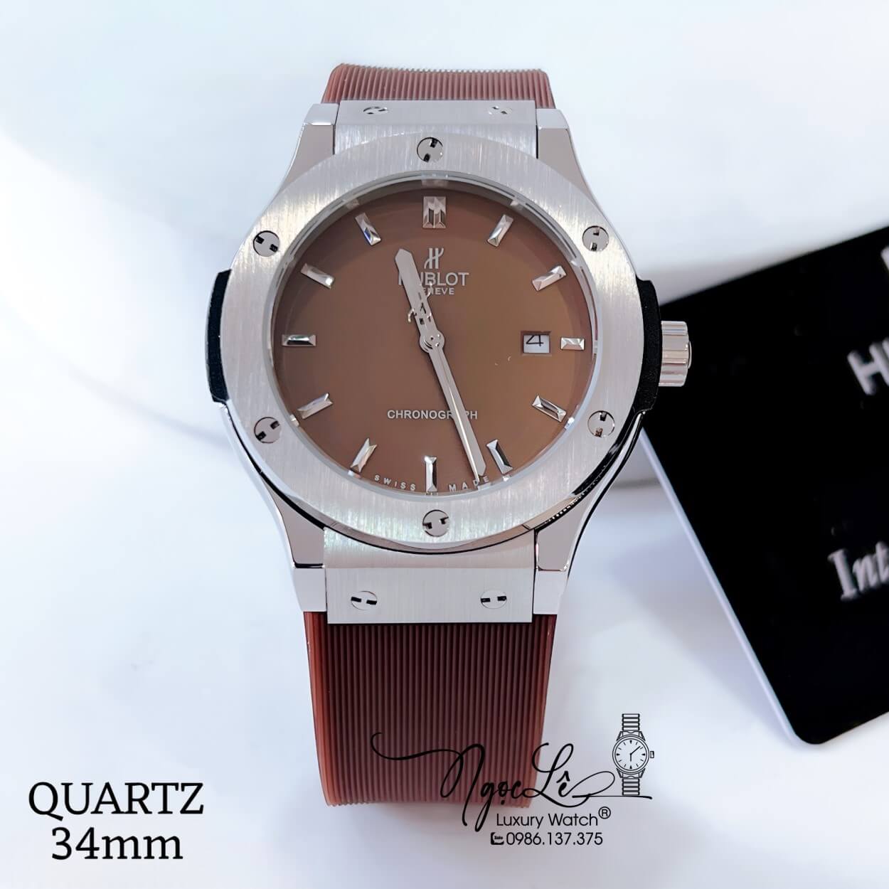 Đồng Hồ Hublot Classic Fusion Nữ Dây Da Silicon Nâu Niềng Trơn Vỏ Thép Silver Size 34mm