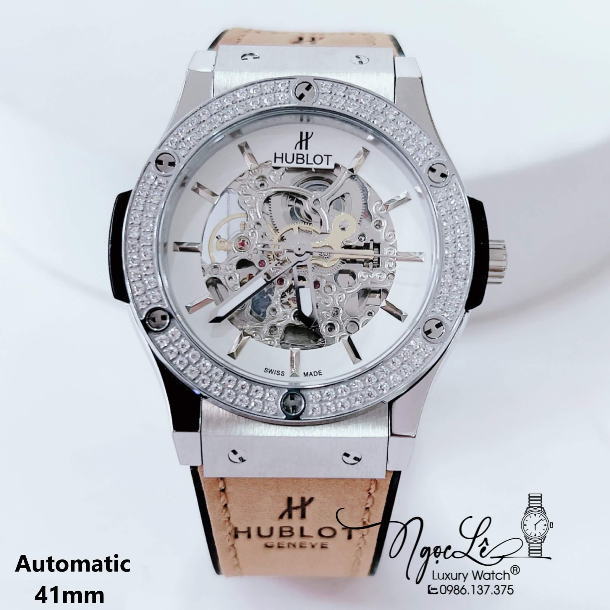 Đồng Hồ Hublot Nam Tự Động Lộ Máy Dây Da Silicon Nâu Đính Đá Bạc Size 41mm